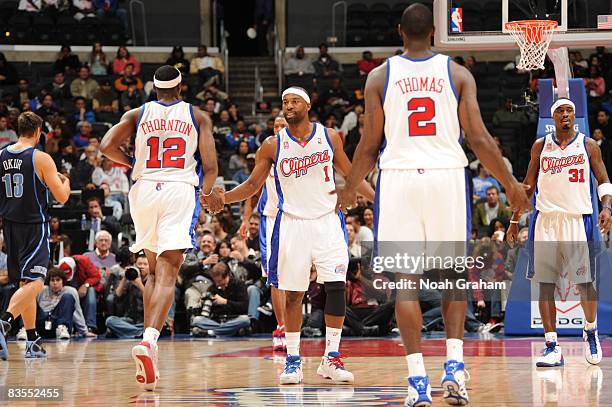 Baron Davis o the Los Angeles Clippers high-fives teammate Al Thornton during a game against the Utah Jazz at Staples Center on November 3, 2008 in...