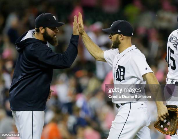 Pitcher Michael Fulmer of the Detroit Tigers celebrates with Tyler Collins of the Detroit Tigers after a win over the Baltimore Orioles at Comerica...