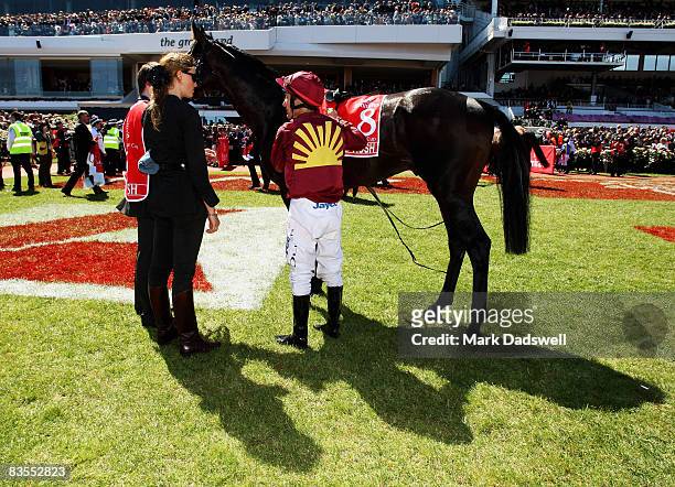 Jockey Damien Oliver speaks with Francesca Cumani after his ride on Mad Rush in the 2008 Emirates Melbourne Cup during The Melbourne Cup Carnival...