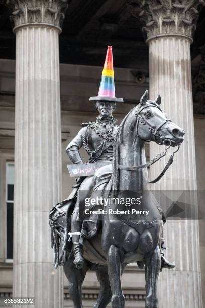 The Duke of Wellington statue outside the Museum of Modern Art gets a new colourful cone on his head for the Glasgow Pride march on August 19, 2017...