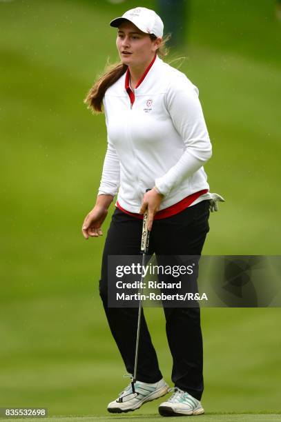 Lily May Humphreys of England reacts to a putt on the 12th green during the final of the Girls' British Open Amateur Championship at Enville Golf...