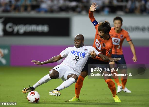 Victor Ibarbo of Sagan Tosu controls the ball under pressure of Kosuke Kikuchi of Omiya Ardija during the J.League J1 match between Sagan Tosu and...