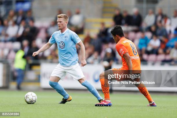 Anders Christiansen of Malmo FF and Wanderson Cavalcante Melo of Athletic FC Eskilstuna during the Allsvenskan match between Athletic FC Eskilstuna...