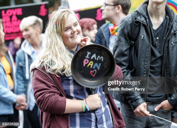 Participant holding a frying pan with the message "I am pan" written on it during the Glasgow Pride march on August 19, 2017 in Glasgow, Scotland....