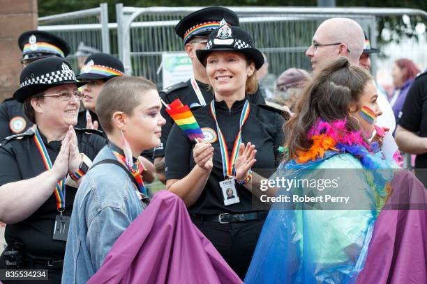 Police officer claps during the Glasgow Pride march on August 19, 2017 in Glasgow, Scotland. The largest festival of LGBTI celebration in Scotland...