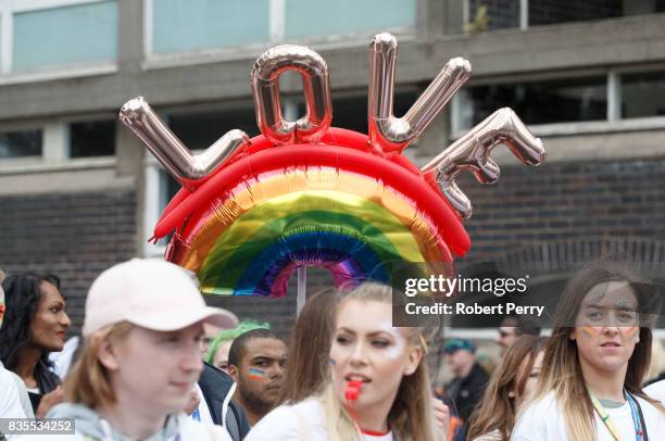 Participant holds a balloon during the Glasgow Pride march on August 19, 2017 in Glasgow, Scotland. The largest festival of LGBTI celebration in...