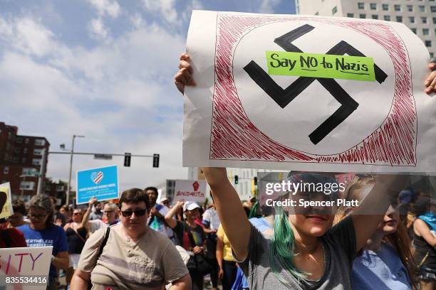 Thousands of protesters march in Boston against a planned 'Free Speech Rally' just one week after the violent 'Unite the Right' rally in Virginia...