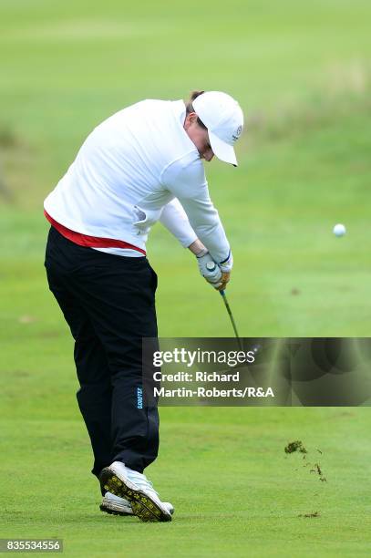 Lily May Humphreys of England hits an approach shot during her semi-final match against Paula Kimer of Germany during the Girls' British Open Amateur...