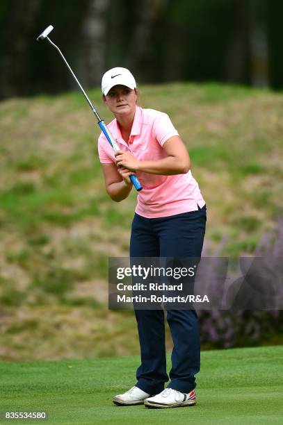 Emilie Overas of Norway reacts to a putt during her semi-final match against Elena Moosmann of Switzerland during the Girls' British Open Amateur...