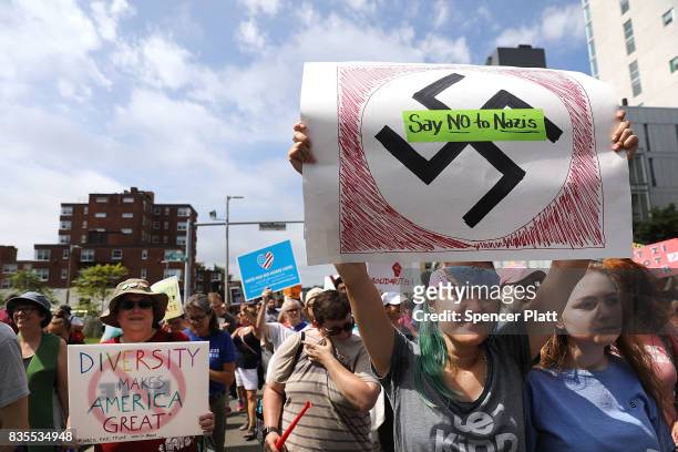 Thousands of protesters march in Boston against a planned 'Free Speech Rally' just one week after the violent 'Unite the Right' rally in Virginia...
