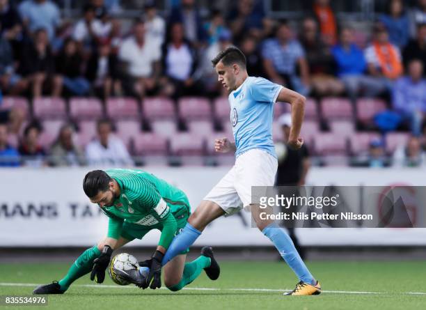 Alireza Haghighi, goalkeeperof Athletic FC Eskilstuna makes a save on an attack from Alexander Jeremejeff of Malmo FF during the Allsvenskan match...