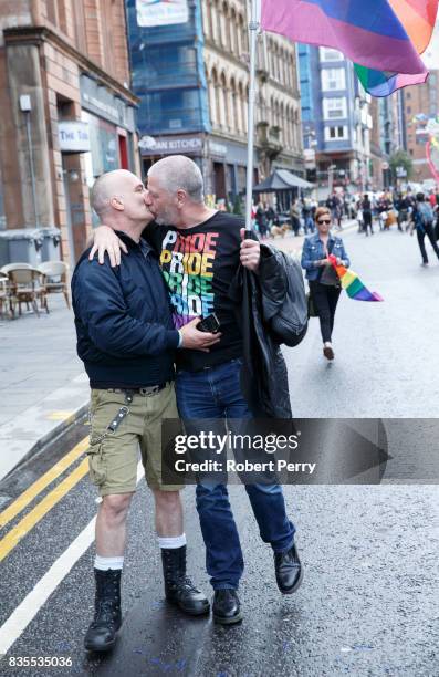 Participants kiss during the Glasgow Pride march on August 19, 2017 in Glasgow, Scotland. The largest festival of LGBTI celebration in Scotland has...