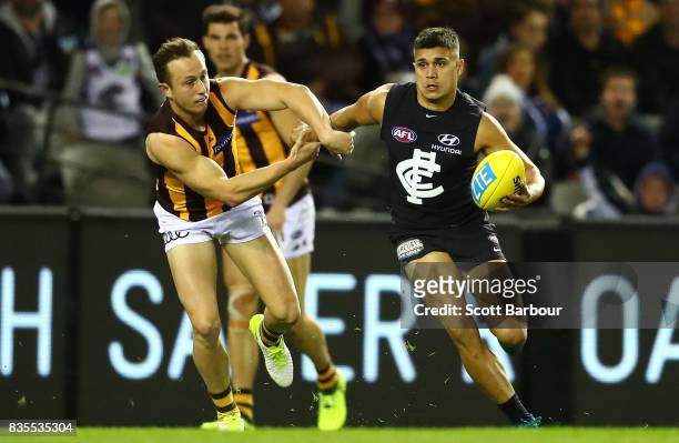 Jarrod Pickett of the Blues runs with the ball during the round 22 AFL match between the Carlton Blues and the Hawthorn Hawks at Etihad Stadium on...