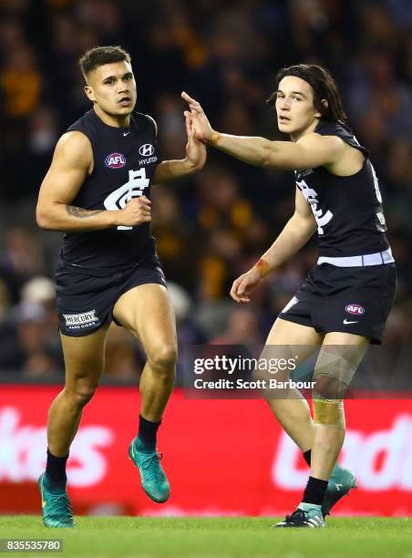 Jarrod Pickett of the Blues is congratulated by Zac Fisher of the Blues after kicking a goal during the round 22 AFL match between the Carlton Blues...