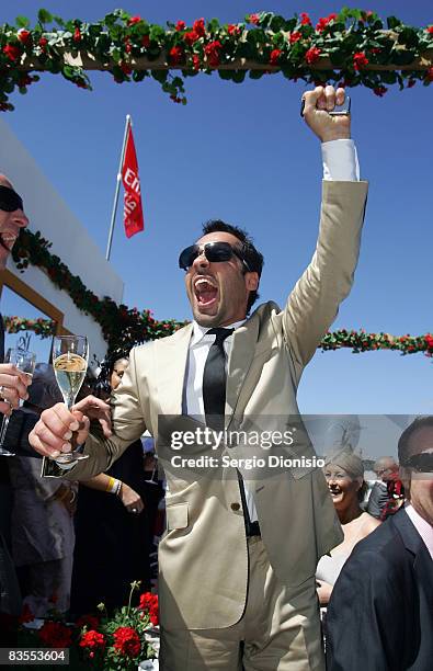 Actor Alex Dimitriades celebrates his win in the Melbourne Cup race at the Emirates Marquee during Emirates Melbourne Cup Carnival 2008 at Flemington...