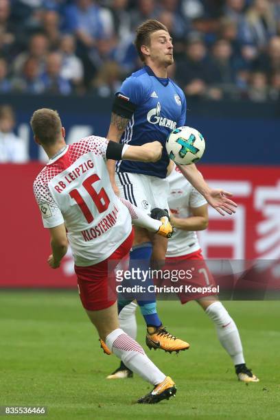 Lukas Klostermann of Leipzig and Bastian Oczipka of Schalke during the Bundesliga match between FC Schalke 04 and RB Leipzig at Veltins-Arena on...