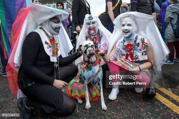 Participants pose with a dalmatian during the Glasgow Pride march on August 19, 2017 in Glasgow, Scotland. The largest festival of LGBTI celebration...