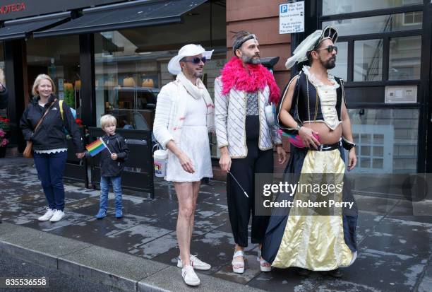 Participants in costumes watch from the pavement during the Glasgow Pride march on August 19, 2017 in Glasgow, Scotland. The largest festival of...