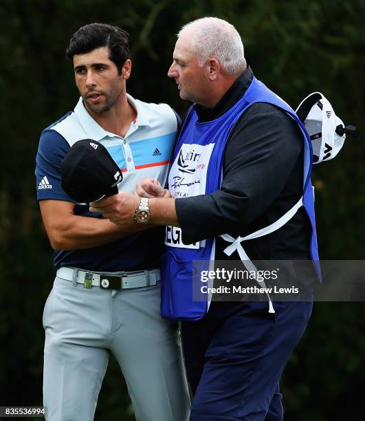 Adrian Oteagui of Spain is congratulated on his win over Alex Knappe of Germany by his caddie during day three of the Saltire Energy Paul Lawrie...