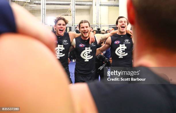 Charlie Curnow of the Blues, Bryce Gibbs of the Blues and their teammates sing the song in the rooms after winning during the round 22 AFL match...