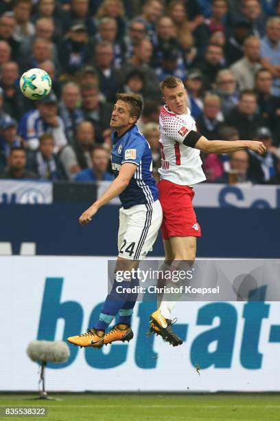 Bastian Oczipka of Schalke and Lukas Klostermann of Leipzig during the Bundesliga match between FC Schalke 04 and RB Leipzig at Veltins-Arena on...