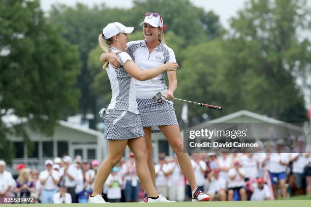 Paula Creamer and Austin Ernst of the United States Team celebrate after they had won their match by 5&3 against Melissa Reid and Emily Pedersen of...