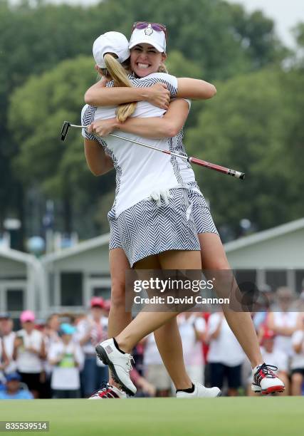 Paula Creamer and Austin Ernst of the United States Team celebrate after they had won their match by 5&3 against Melissa Reid and Emily Pedersen of...