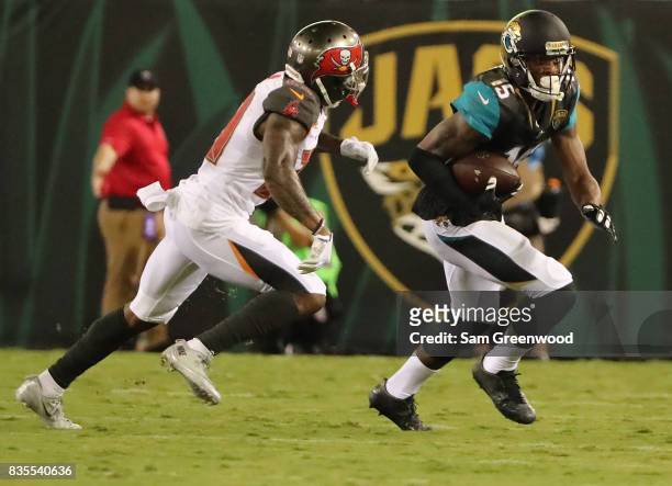 Allen Robinson of the Jacksonville Jaguars attempts to run past Ryan Smith of the Tampa Bay Buccaneers during a preseason game at EverBank Field on...