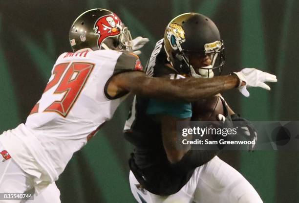 Allen Robinson of the Jacksonville Jaguars attempts to run past Ryan Smith of the Tampa Bay Buccaneers during a preseason game at EverBank Field on...