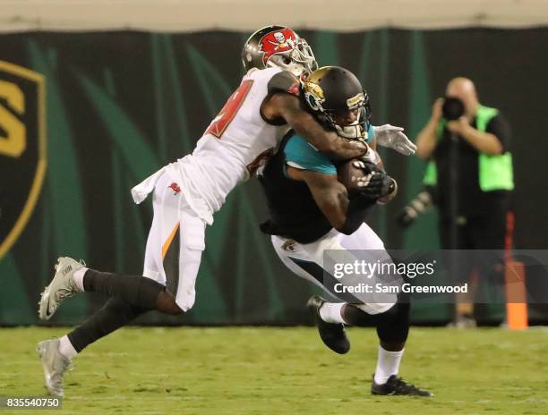 Allen Robinson of the Jacksonville Jaguars attempts to run past Ryan Smith of the Tampa Bay Buccaneers during a preseason game at EverBank Field on...