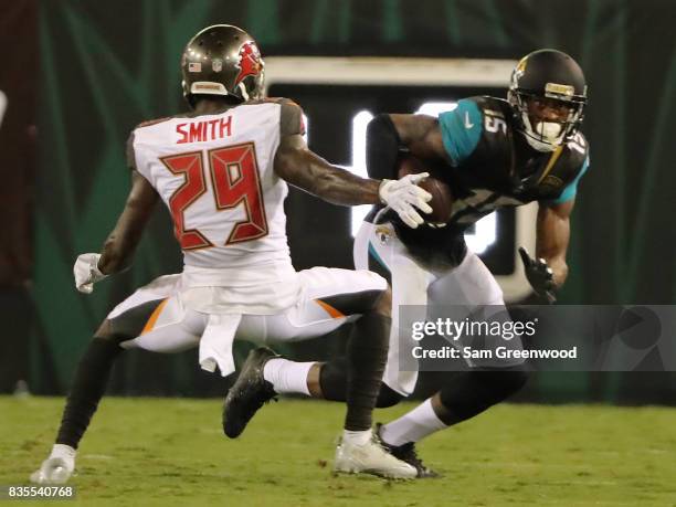 Allen Robinson of the Jacksonville Jaguars attempts to run past Ryan Smith of the Tampa Bay Buccaneers during a preseason game at EverBank Field on...