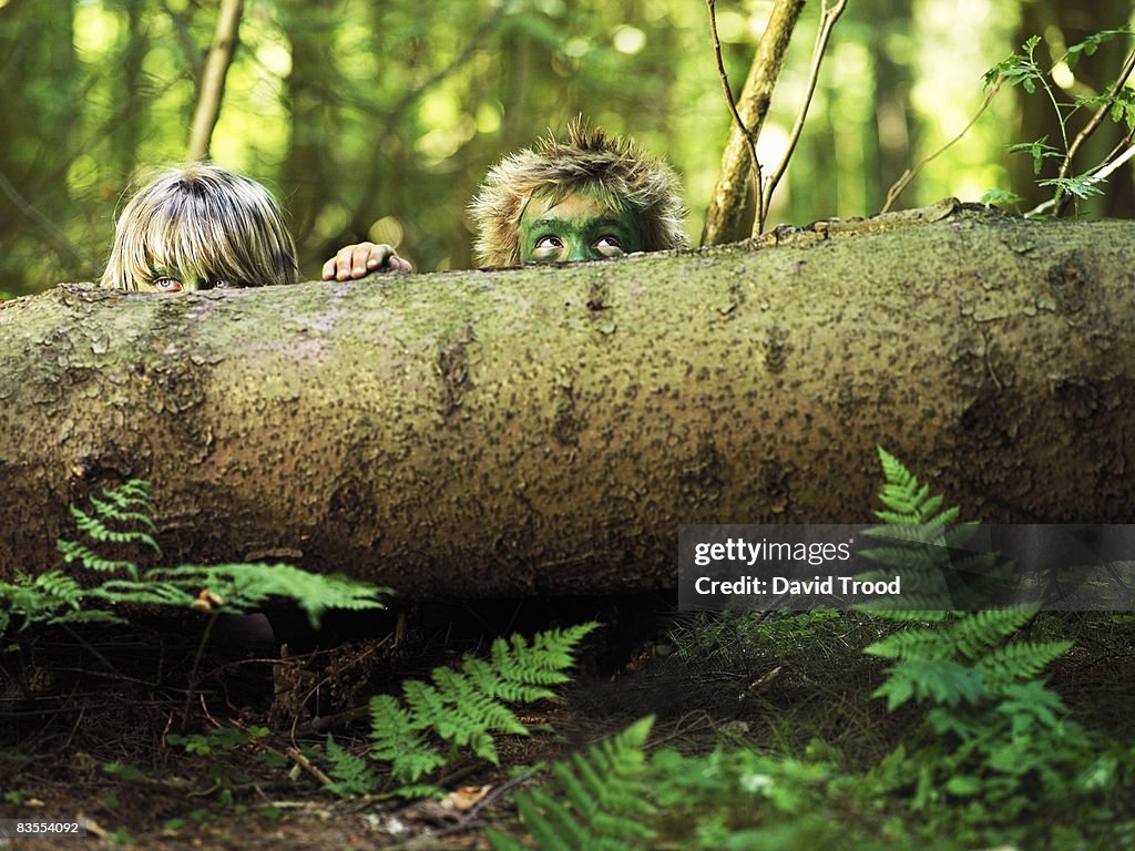 Boys hiding in the forest.
