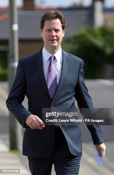 Lib Dem leader Nick Clegg arrives at a polling station at Dryburgh Hall in Putney, London, to vote in the European election.