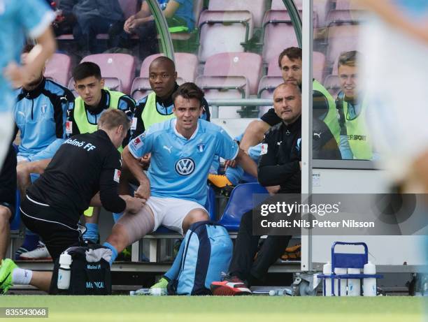 Andreas Vindheim of Malmo FF gets medical attention during the Allsvenskan match between Athletic FC Eskilstuna and Malmo FF at Tunavallen on August...