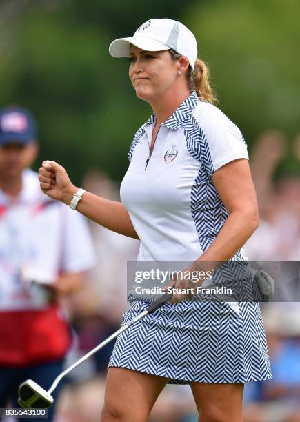 Cristie Kerr of Team USA celebrates holeing the winning putt during the second day morning foursomes matches of The Solheim Cup at Des Moines Golf...