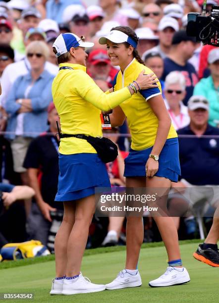 Georgia Hall of Team Europe celebrates a two and one victory with Annika Sorenstam during the morning foursomes matches of the Solheim Cup at the Des...