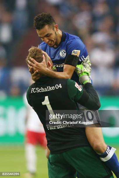 Nabil Bentaleb of Schalke celebrate with Ralf Faehrmann of Schalke after he scored to make it 1:0 during the Bundesliga match between FC Schalke 04...