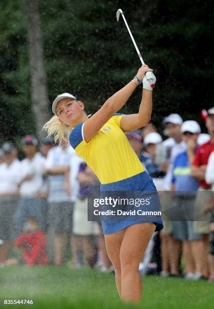 Emily Pedersen of Denmark and the European Team plays her second shot on the 13th hole in her match with Melissa Reid against Paula Creamer and...