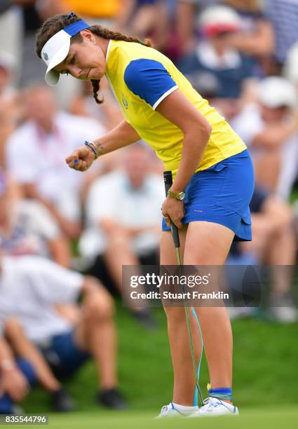 Georgia Hall of Team Europe celebrates holeing the winning putt during the second day morning foursomes matches of The Solheim Cup at Des Moines Golf...