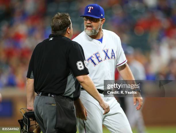 Doug Brocail of the Texas Rangers contest a balk call and is ejected from the game by Doug Eddings umpire in the ninth inning at Globe Life Park in...