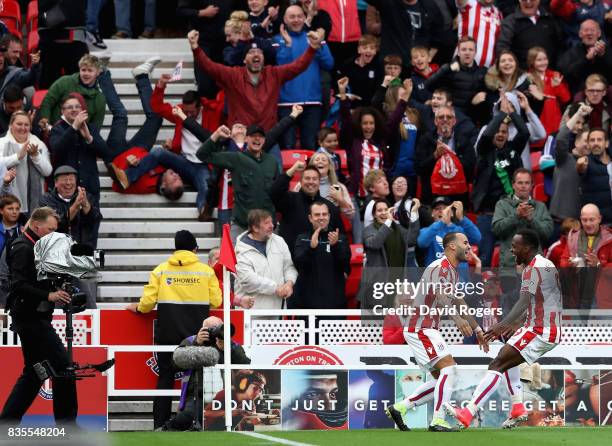 Jese of Stoke City celebrates scoring his sides first goal with Saido Berahino of Stoke City during the Premier League match between Stoke City and...