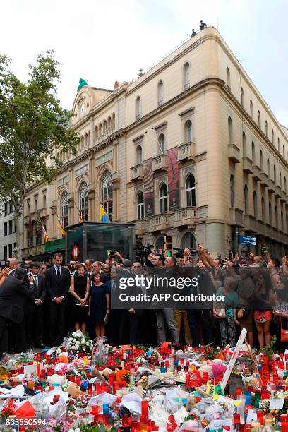 Spain's King Felipe VI and Spain's Queen Letizia pay tribute to the victims of the Barcelona attack on Las Ramblas boulevard, in Barcelona on August...