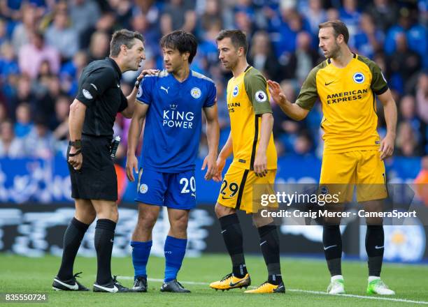 Leicester City's Shinji Okazaki shares a joke with Referee Lee Probert during the Premier League match between Leicester City and Brighton and Hove...