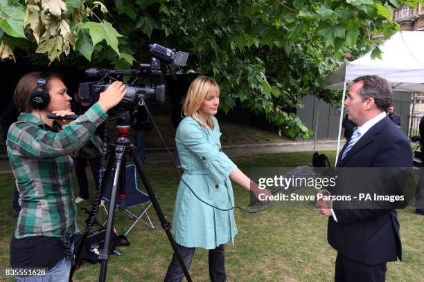 Shadow Defence secretary Dr Liam Fox is interviewed by PA staff Ellie Price and Charlotte McCathie on Abingdon Green near the House of Commons in...