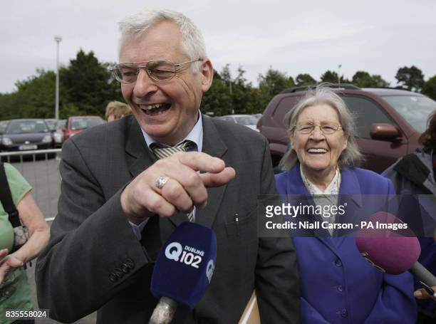 Socialist party candidate Joe Higgins arrives with his mother Ellen as counting continues in the European elections at the RDS centre in Ballsbridge,...