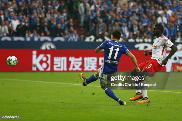 Yevhen Konoplynka of Schalke scores to make it 2:0 while Dayot Upamecano of Leipzig looks on during the Bundesliga match between FC Schalke 04 and RB...