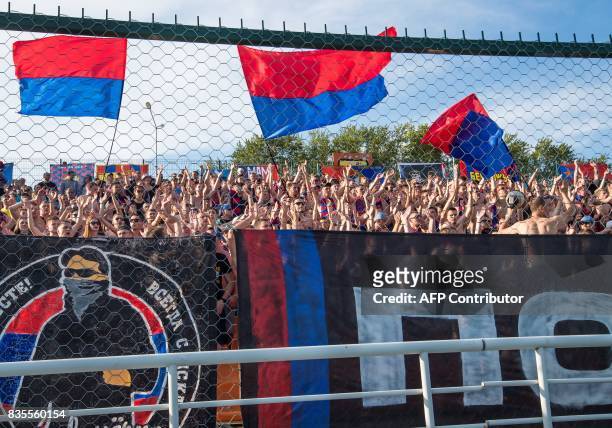 Supporters of Moscow's CSKA shout slogans during the Russian Premier League match CSKA Moscow vs FC Ural Yekaterinburg at the SKB-Bank Arena in...
