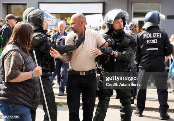 Neo-Nazi demonstrator is arrested by police as he and others march at an extreme right-wing demonstration commemorating the 30th anniversary of the...