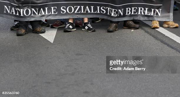 Neo-Nazis march at an extreme right-wing demonstration commemorating the 30th anniversary of the death of Nazi leader Rudolf Hess, Adolf Hitler's...