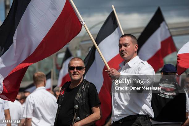 Participants of a Neo-Nazi demonstration are seen holding nationalistic flags at a gathering point prior to an extreme right mass demonstration, on...